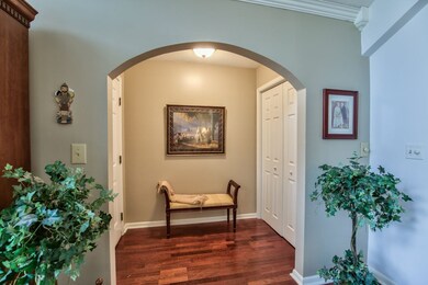 Foyer has a large closet for storing coats and ope