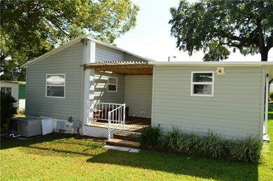 West side of home showing back of storage room and
