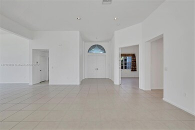 This home boasts a formal foyer entry and 12 foot volume ceilings through out.