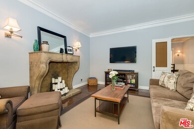 DECORATIVE FIREPLACE AND INTRICATE CROWN MOLDINGS
