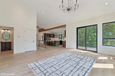 Living room with kitchen deck visible