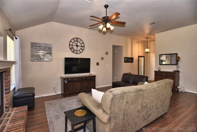 Vaulted ceiling in living. Laminate wood floor thr