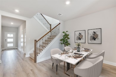 Dining space with light wood finished floors, rec