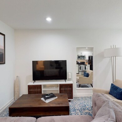 Living area with recessed lighting and wood finished floors