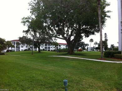 View of property's community featuring a lawn