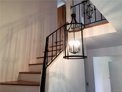 Staircase leads up to 3 bedrooms and another full 