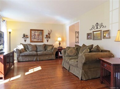 Light & Bright Living Room with Hardwood Floors