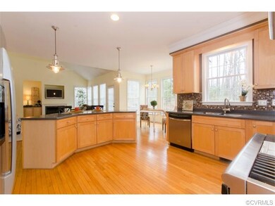 Open-concept kitchen with tons of cabinets, corian