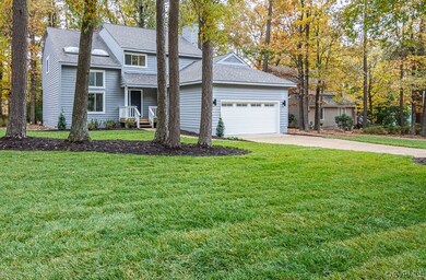 Beautiful yard with new landscaping and sod.