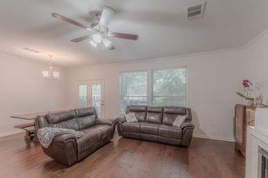 Living area with ornamental molding, wood finishe