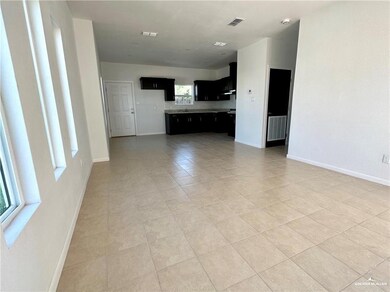 Unfurnished living room with light tile patterned flooring