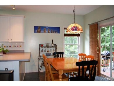 Eat-in kitchen with breakfast bar, flows into grea