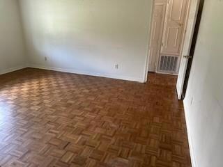 Livingroom with dark parquet floors