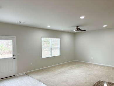 Unfurnished room featuring light colored carpet, b