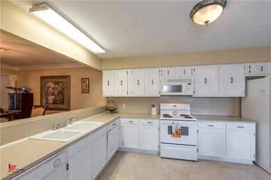 Huge kitchen with lots of countertops and cabinets