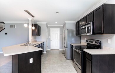 Stainless Steel Appliances and Crown Molding!