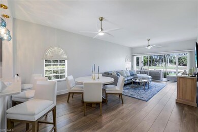 Dining space featuring wood finished floors and ce