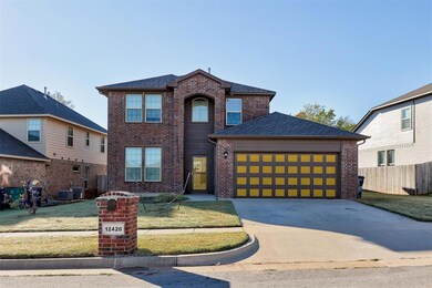 View of front of home featuring a garage and a fro
