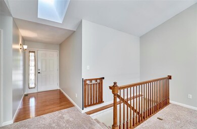 Pretty entry with hardwood flooring and side light