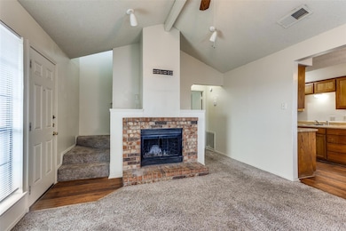 Unfurnished living room featuring lofted ceiling w
