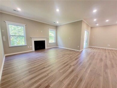 open living room with LVP flooring, extra lighting