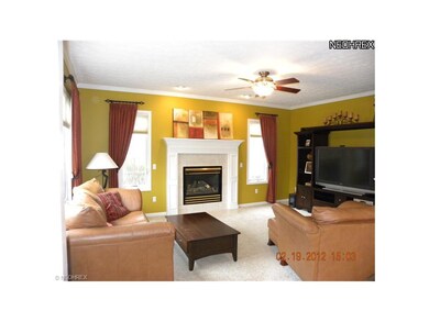 The bright family room features a ventless firepla