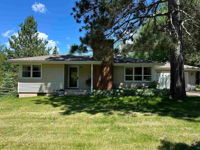 Single story home with shaded front yard.