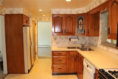 Another view of the kitchen shows through way to h