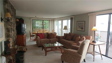 Living/Dining room w/ lake views