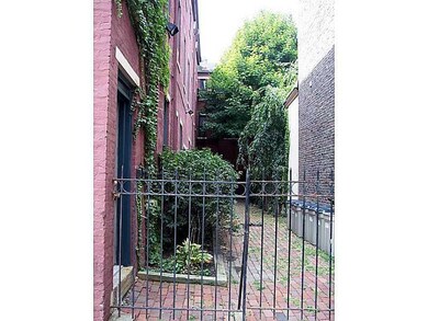 Exterior Back. Shared courtyard access to apartmen
