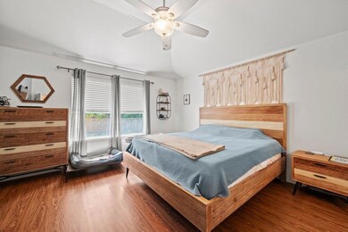 Bedroom featuring wood finished floors and a ceil