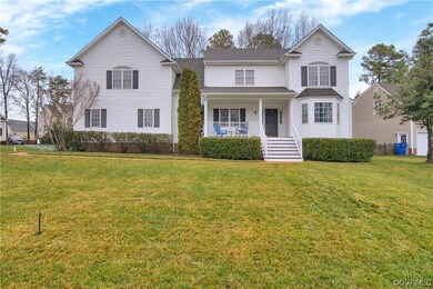 View of front property with a front yard and cover