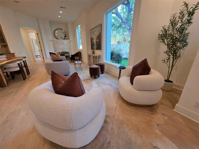 Sitting room featuring light wood-type flooring, 
