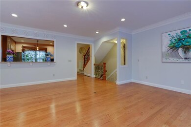 Unfurnished living room featuring light wood-style