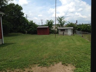 Large back yard with 2 storage buildings. Lots of room for backyard football games. 