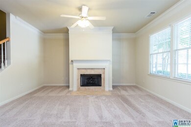 Another view of living room and fireplace
