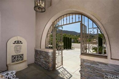 Beautiful Stone Entrance with Rod Iron Gate