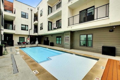 Community pool featuring a patio