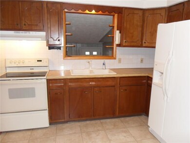 Kitchen. Kitchen has view of the bonus room with v