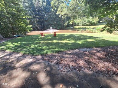 BEAUTFUL FRONT YARD WITH POND AND FOUNTA