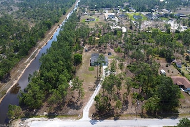 View of property location with a nearby body of wa