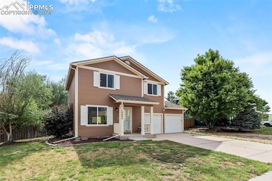 View of front of home featuring driveway and an attached garage