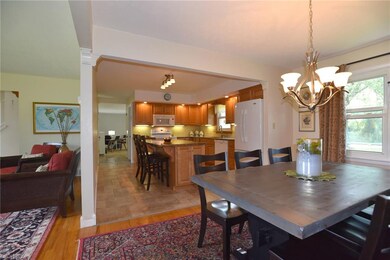 View from dining room into living room and kitchen