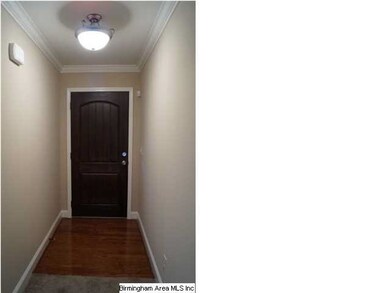Foyer with hardwood floor