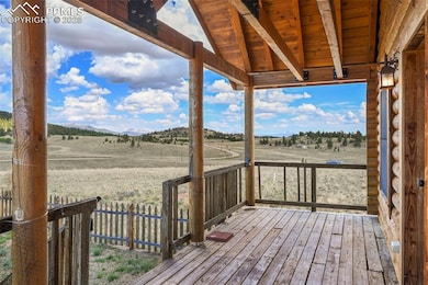Wooden deck with a rural view and a mountain view