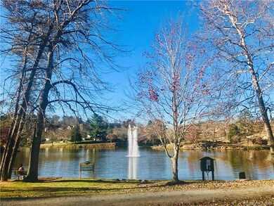 Community directly across from Lake Louise, walking trail, and park!