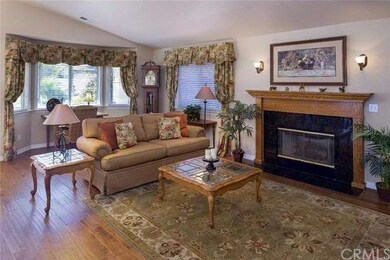 Spacious living room has beautiful wood flooring, 