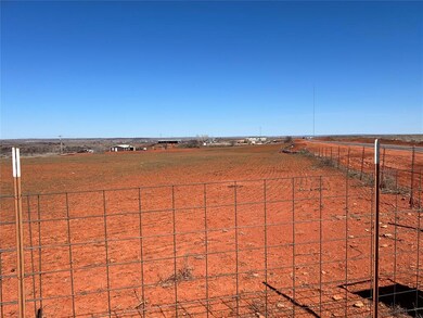 View of 5 acres zoned commercial featuring fence a