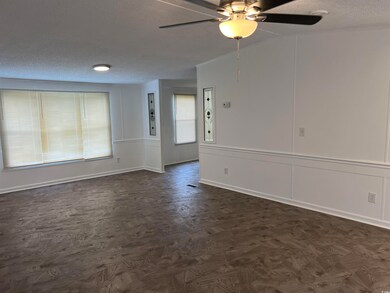 Empty room featuring a textured ceiling and ceilin