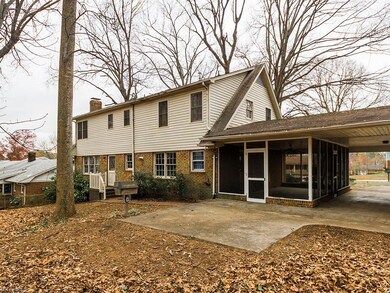 The back of the house shows the back steps leading int the den through the dutch door.
